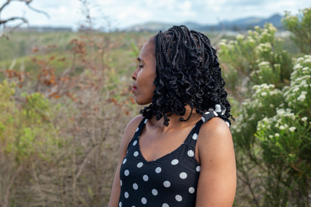 Woman seen meditating in natureの写真素材