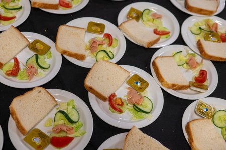 Plates with bread lined in a rowの写真素材