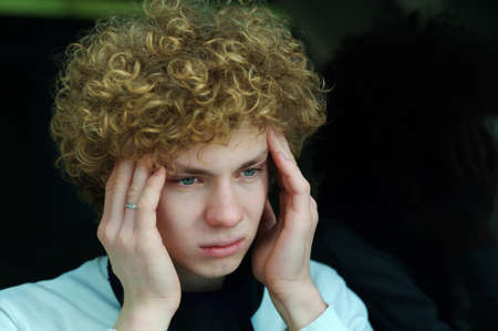 portrait of a young man with curly hair