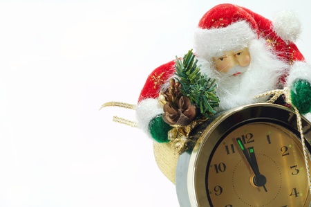 Christmas Santa Claus with a clock white backgroundの写真素材