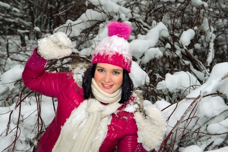 beautiful girl in the background of a snowy forestの写真素材