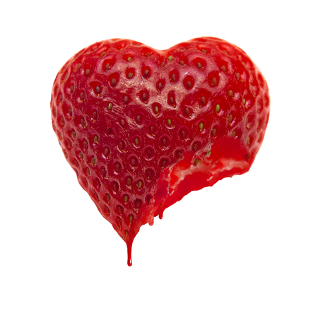 Ripe heart-shaped strawberry on a white backgroundの写真素材