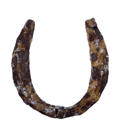 very old rusty horseshoe isolated on whiteの写真素材