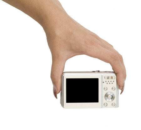 digital camera in a hand isolated on white
