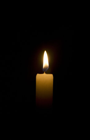 candle flame over black background