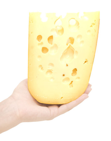 piece cheese in a woman hand over whiteの写真素材
