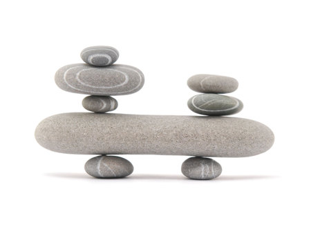 balancing stones isolated on a white backgroundの写真素材
