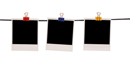 polaroids on a rope isolated on white