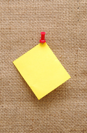 empty note over sackcloth backgroundの写真素材