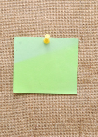 empty note over sackcloth backgroundの写真素材