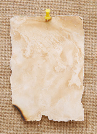 empty note over sackcloth backgroundの写真素材