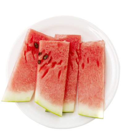 ripe watermelon slices on plate isolated on whiteの写真素材