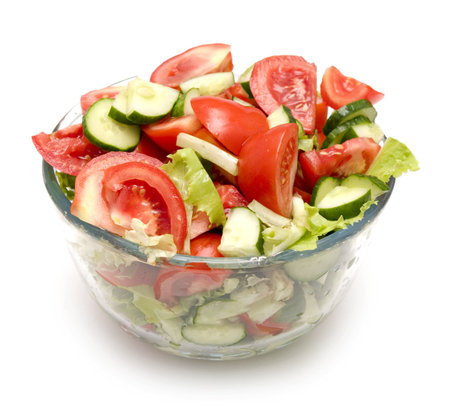 salad in a bowl isolated on whiteの写真素材