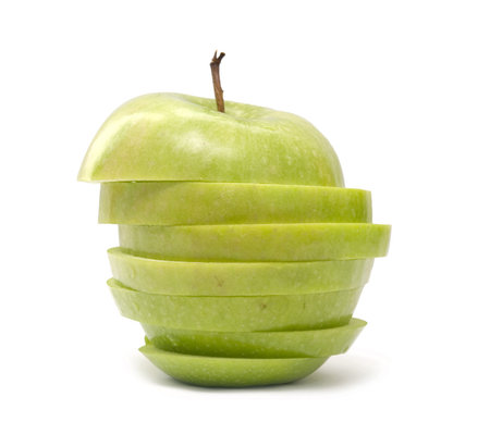 ripe green apple cut isolated on whiteの写真素材