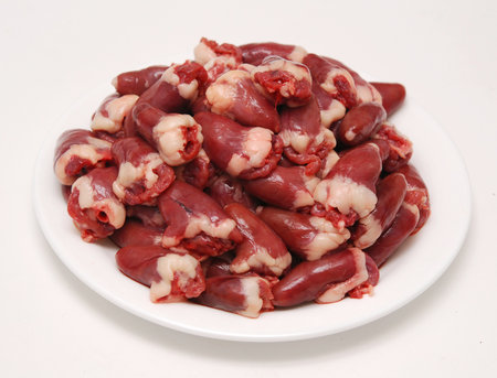 fresh bird hearts in plated over whiteの写真素材