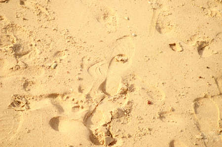sea sand with footprintsの写真素材