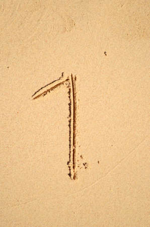 number one written on the sand