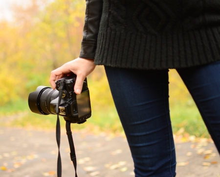 digital camera in woman hand