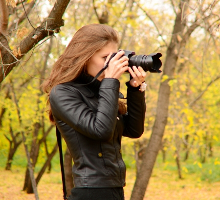 beautiful young woman nature photographer の写真素材