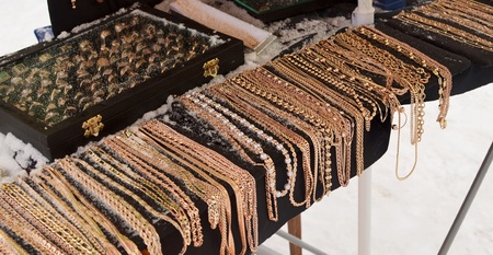 golden chains and rings in marketの写真素材