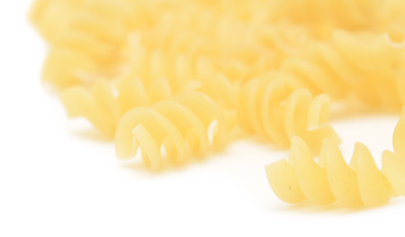 raw pasta isolated on whiteの写真素材