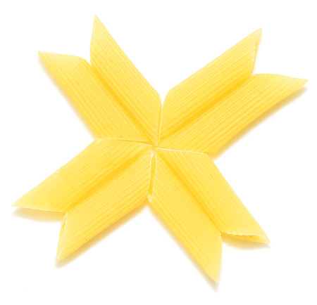 raw pasta isolated on white backgroundの写真素材