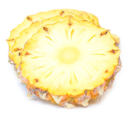 pineapple slices isolated on white backgroundの写真素材