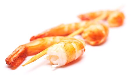 grilled shrimps on wooden stick isolated on white backgroundの写真素材