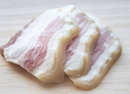 close up of salted lard on wooden boardの写真素材