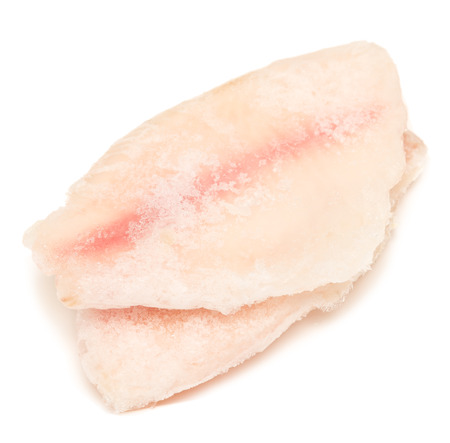 frozen fish fillet isolated on white backgroundの写真素材