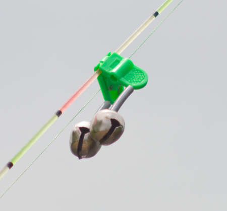 close up shot of bell on rodの写真素材