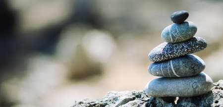 balancing stones with beautiful bokeh