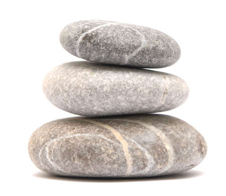 balancing stone tower isolated on white background