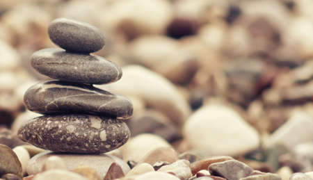 balancing stone tower on the beach
