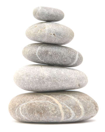 balancing stone tower isolated on white backgroundの写真素材