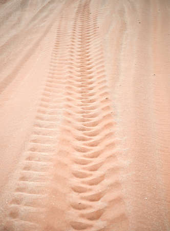 wheel track on sandの写真素材