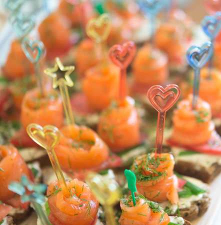 canapes with red fish(focus on sticks)の写真素材