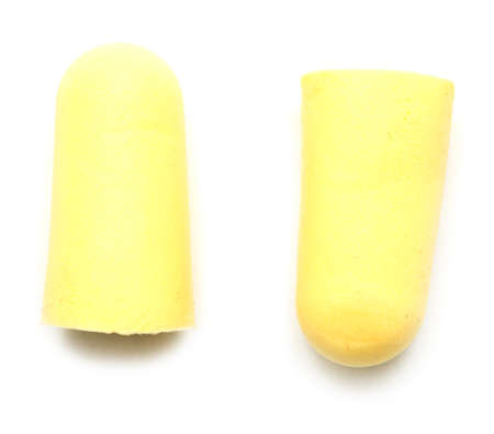 two yellow earplugs isolated on white background