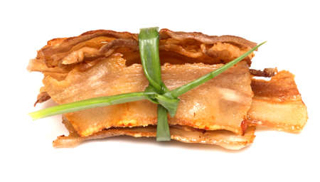 grilled bacon isolated on white backgroundの写真素材