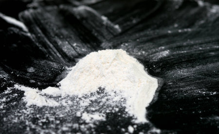 white powder on black backgroundの写真素材