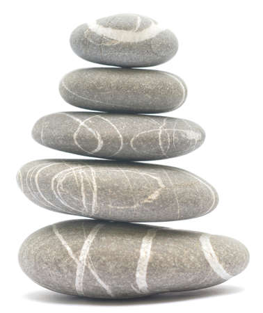 balancing stones isolated on white backgroundの写真素材
