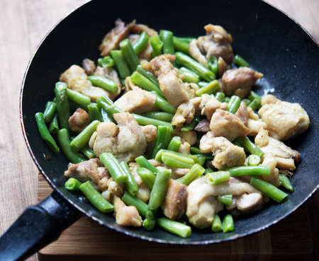 chicken with green beans in fried panの写真素材