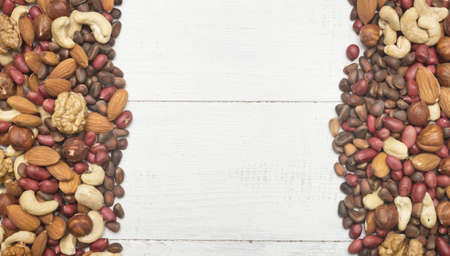 mixed nuts on wooden backgroundの写真素材