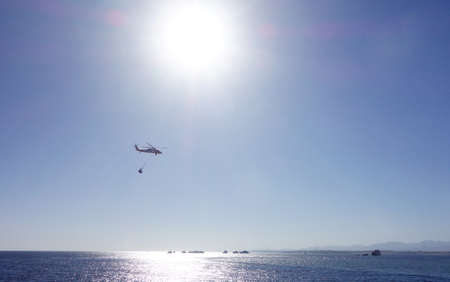 helicopter over seaの写真素材