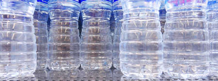 Close up shot of plastic bottles with waterの写真素材