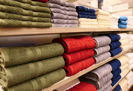 Piles of towels on the shelvesの写真素材