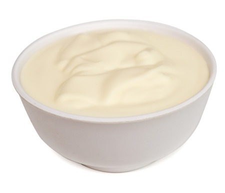 Fresh sour cream isolated on white backgroundの写真素材