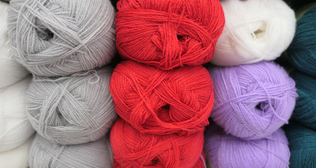 Close up shot of colored wool yarn balls