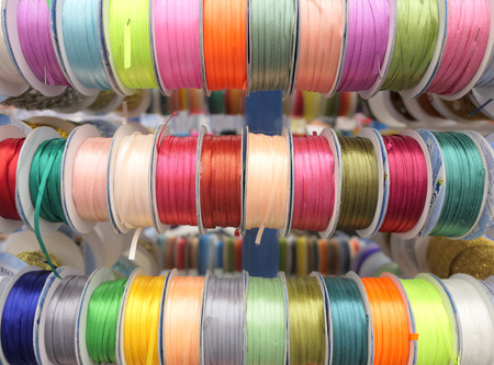 Colorful ropes on bobbinsの写真素材