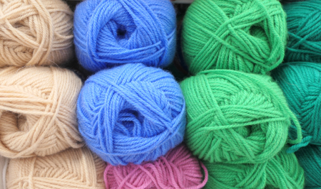 Close up shot of colored wool yarn balls